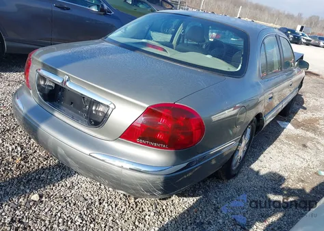 2000 Lincoln Continental z USA, uszkodzony, nr VIN 1LNHM97VXYY909028